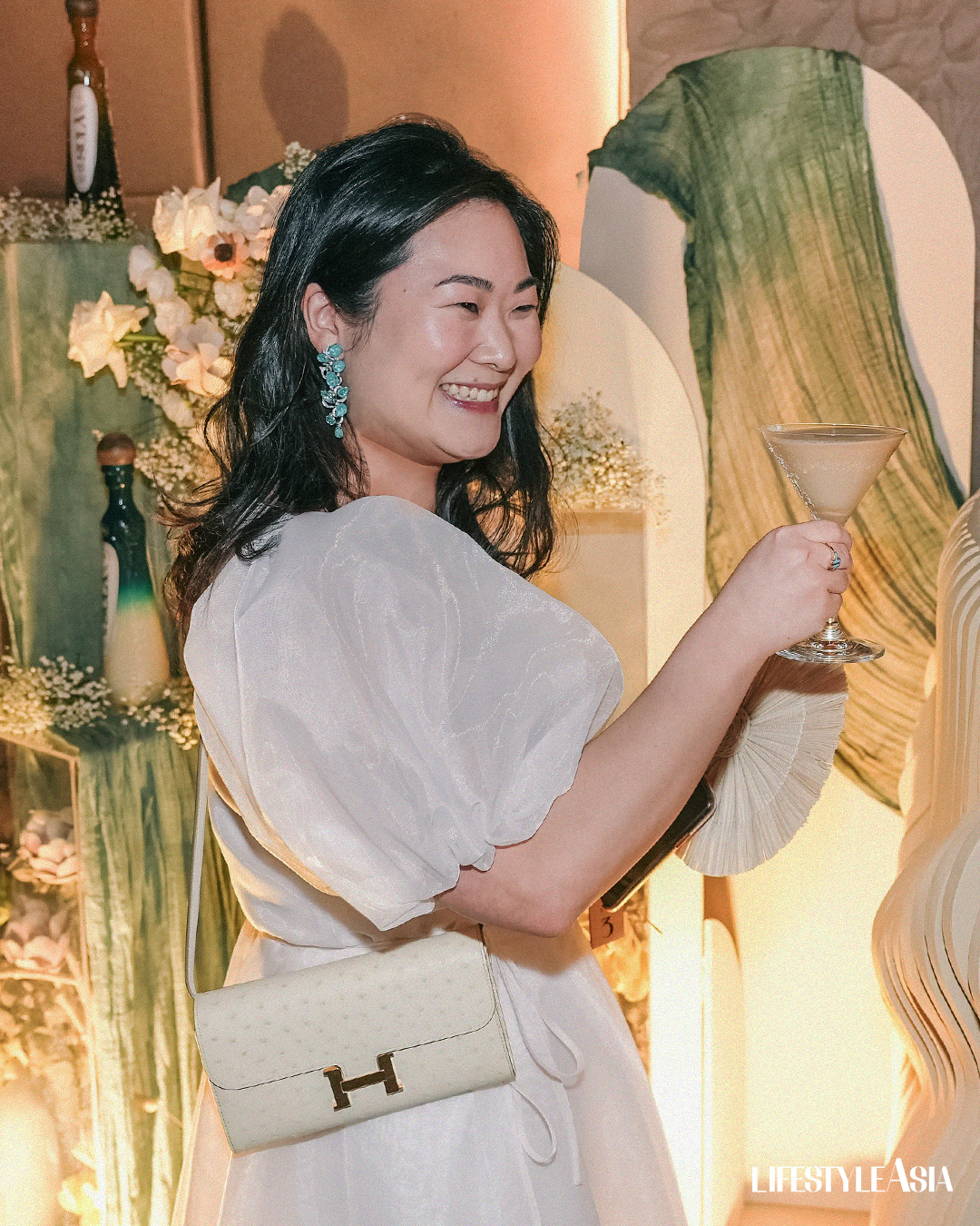 Renowned resort owner Cassey Yap drinking Sky and Sand cocktail from Sula Spirits
