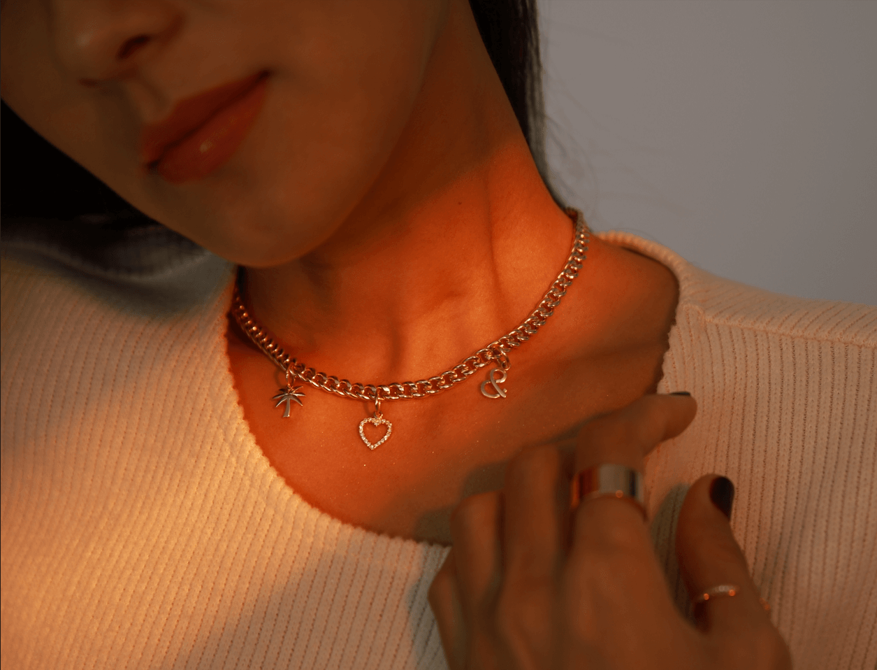 A personalized necklace with pieces from the Chapters capsule collection 