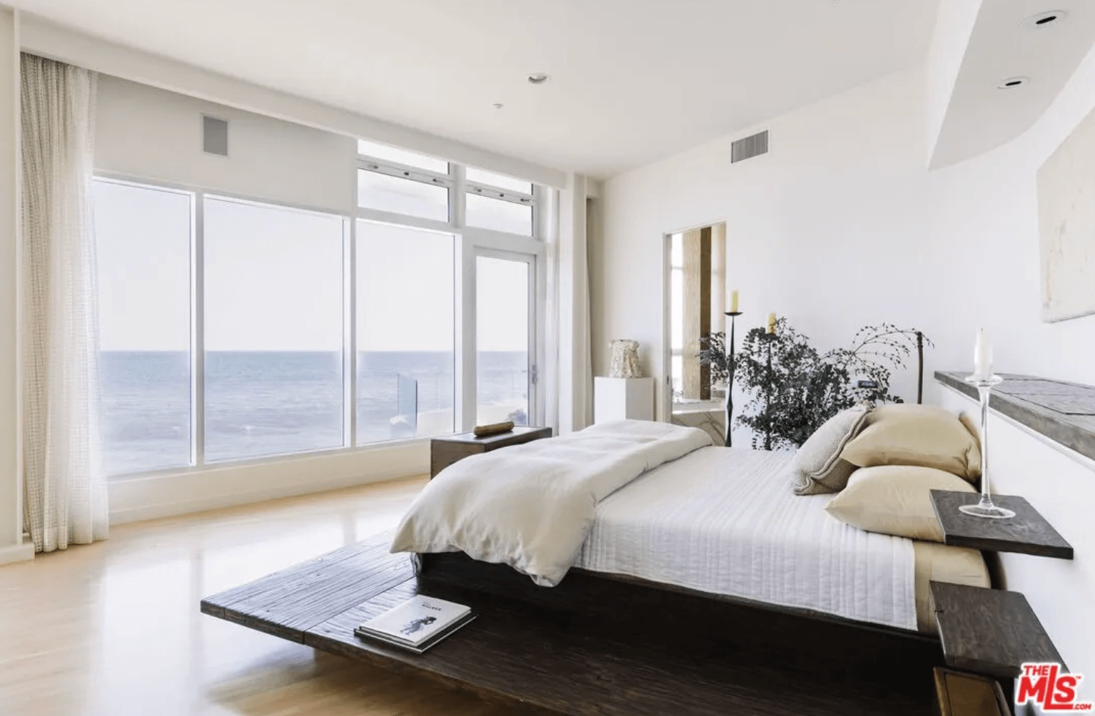 A bedroom in Berry’s mansion with a view of the ocean