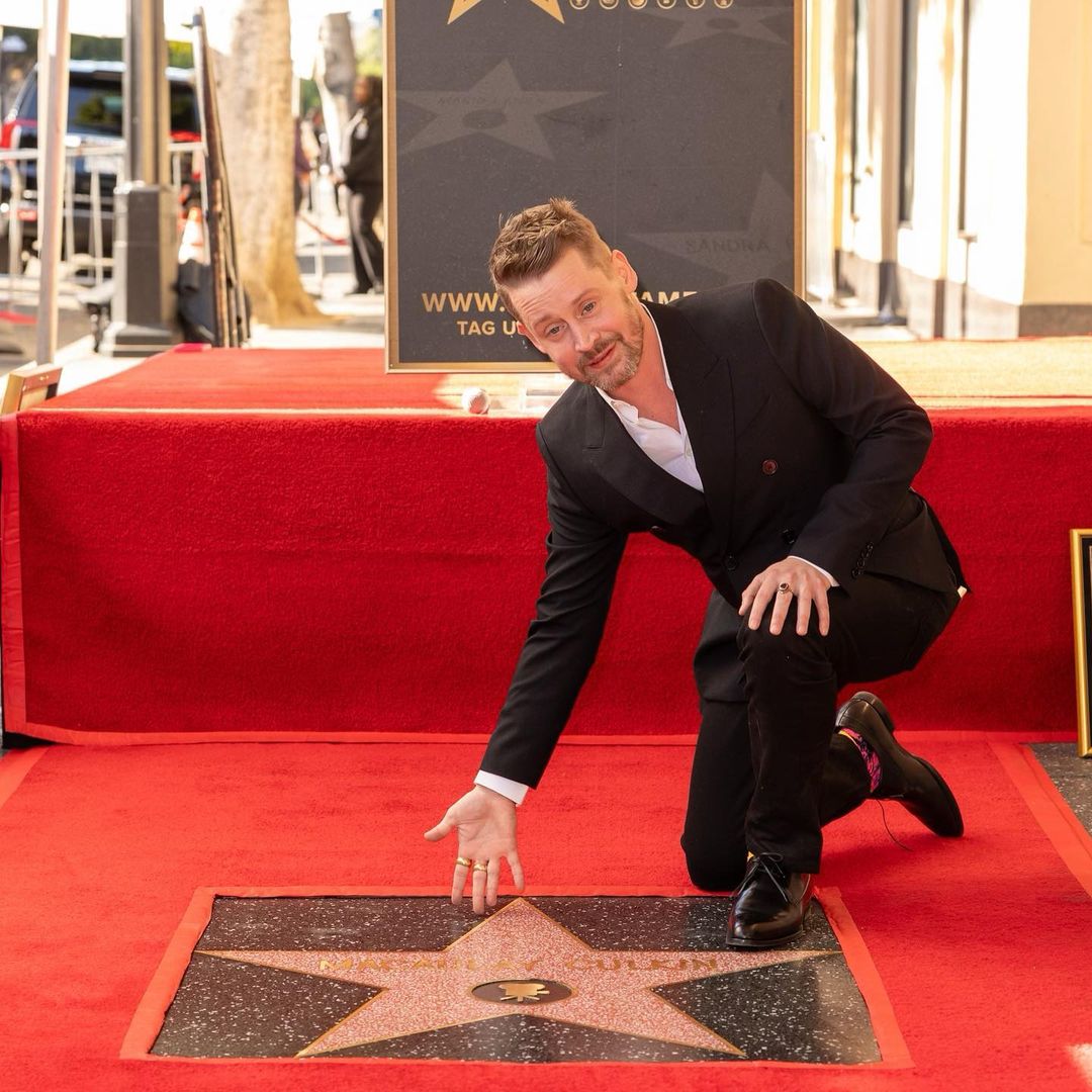 Macaulay Culkin poses with his star