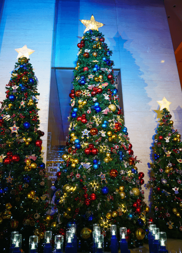 The Joy~Nostalg Christmas tree with recycled Nespresso capsule ornaments from NVC and solar lamps from Liter of Light