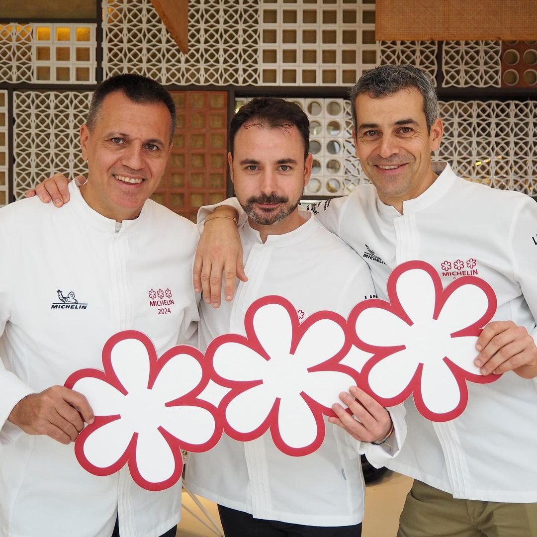 Chefs Mateu Casañas, Oriol Castro and Eduard Xatruch with their three Michelin stars for Disfrutar