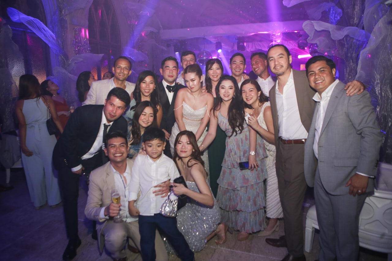 The newlyweds with some of their guests at the after party