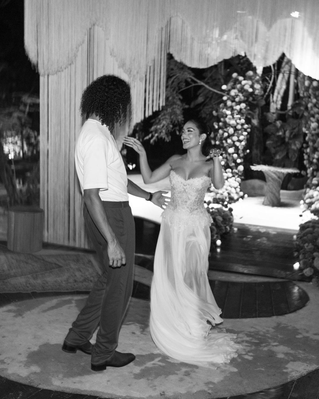 The blushing bride dances with a second gown from Vera Wang