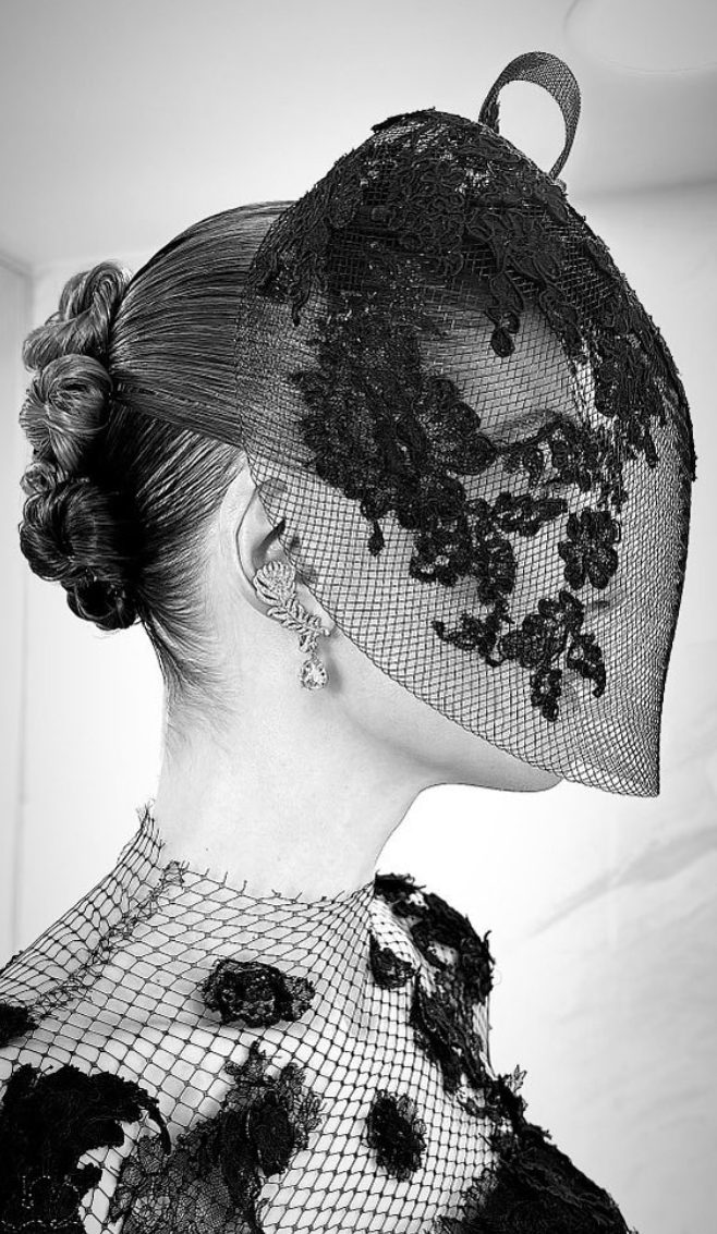 As Pike graced the red carpet, Variety caught up with her, and she unveiled the intriguing reason behind her choice of headwear.