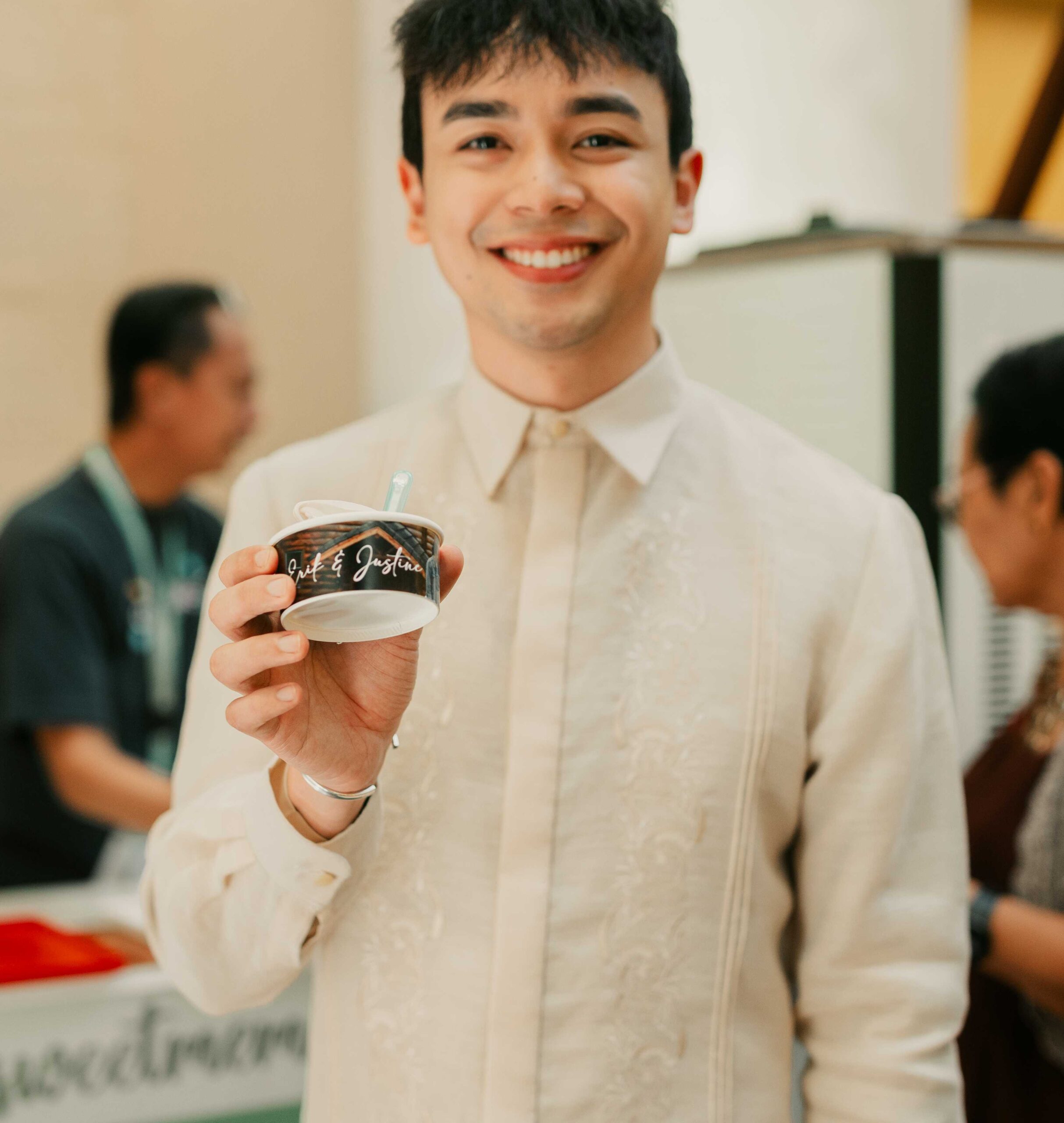 Justine Burgos' brother Earl is holding a soft serve Chocnut ice cream from The Lost Bread