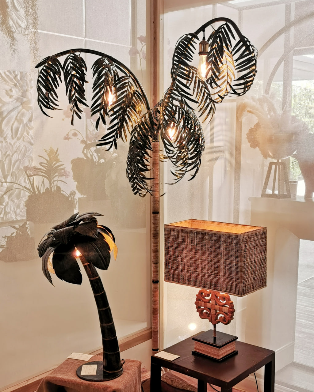 From left to right: Mini Coco in handcut and hammered metal cans;  Mr Palmer; and Ukit in mahogany wood from felled trees with abaca shade