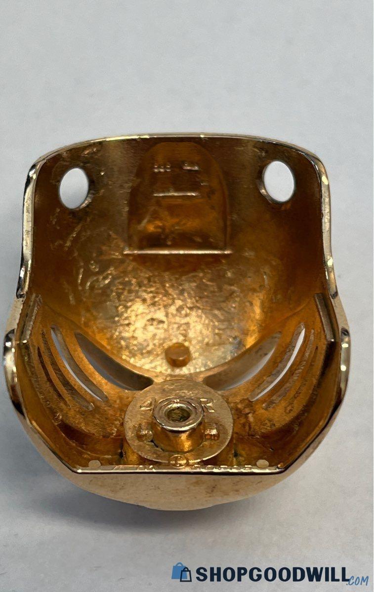 The gold LEGO piece’s back part