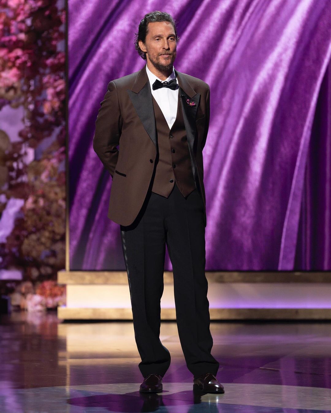 Matthew McConaughey appeared in a crisp brown ensemble by Atelier Versace