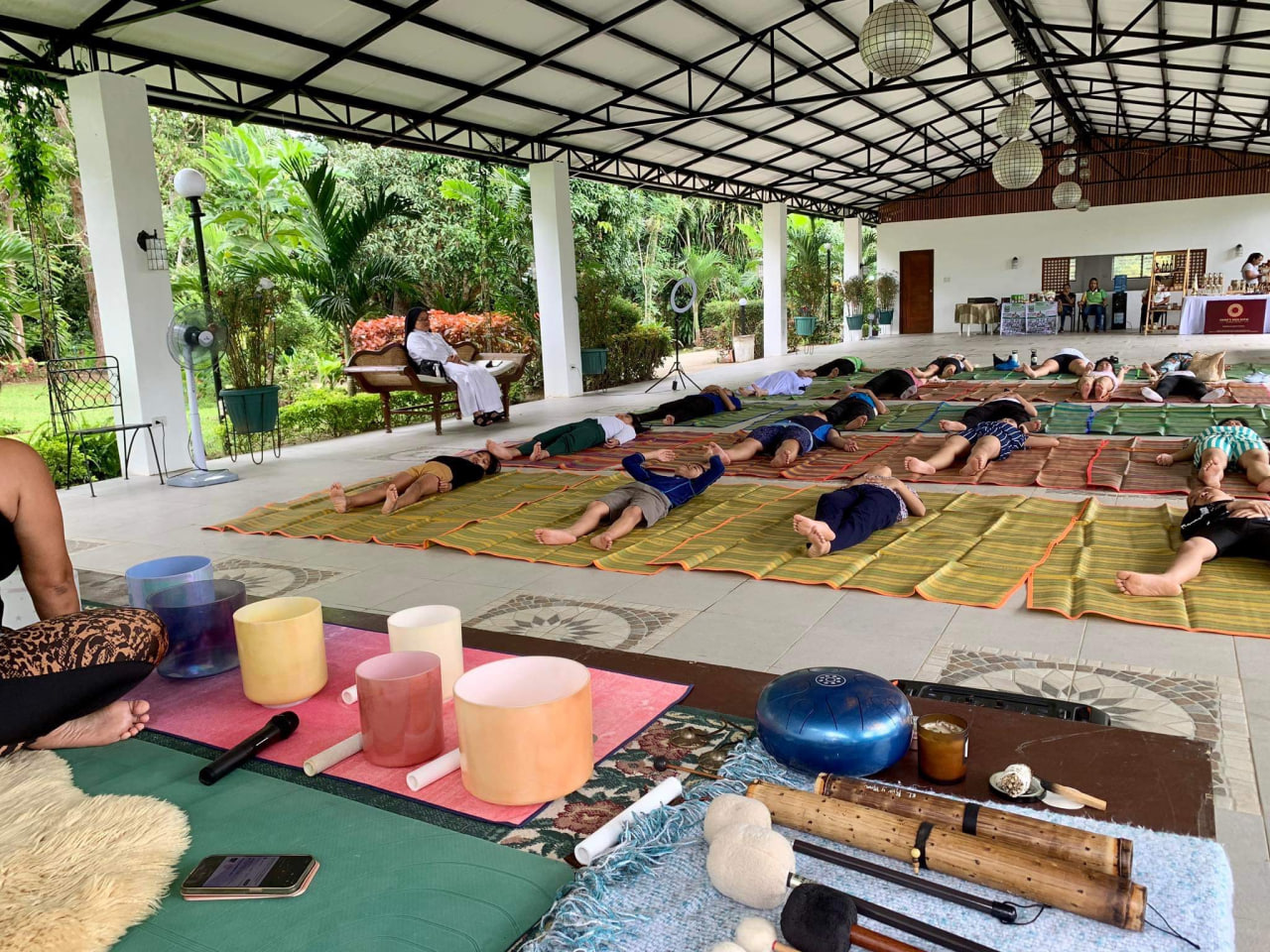 Participants immerse themselves in a sound bath’s enchanting sonic experience