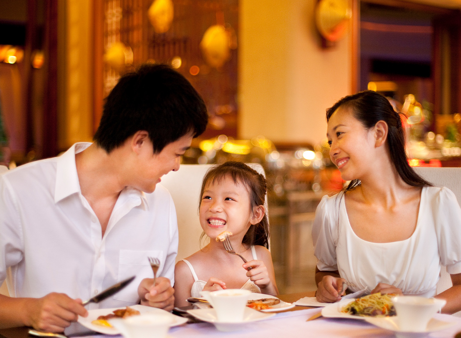 A happy family eating healthy meals together