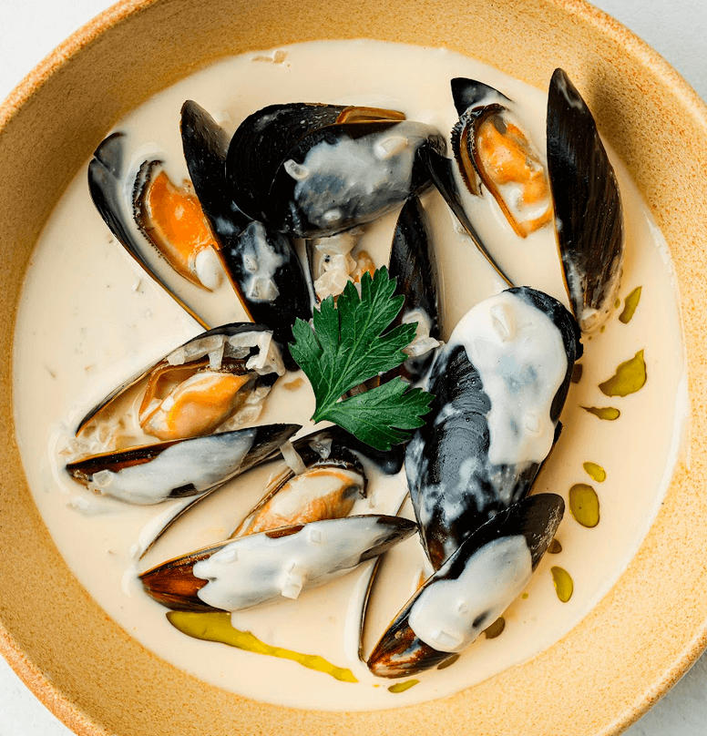 TOP LEFT: 24-hour Sous-Vide Crispy Pork Pata On Macadamia Kare-Kare; TOP RIGHT: Vuco Fye ; BOTTOM LEFT: Fritto Misto Battered Prawns, Tawilis and Vegetables with Calamansi Aioli ; BOTTOM RIGHT: Chilean Mussels Green Curry and Coconut