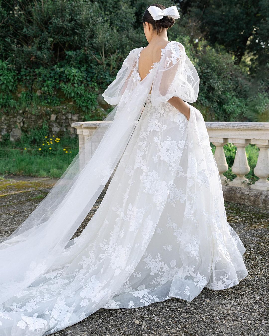 This gown has a dramatic train and cape