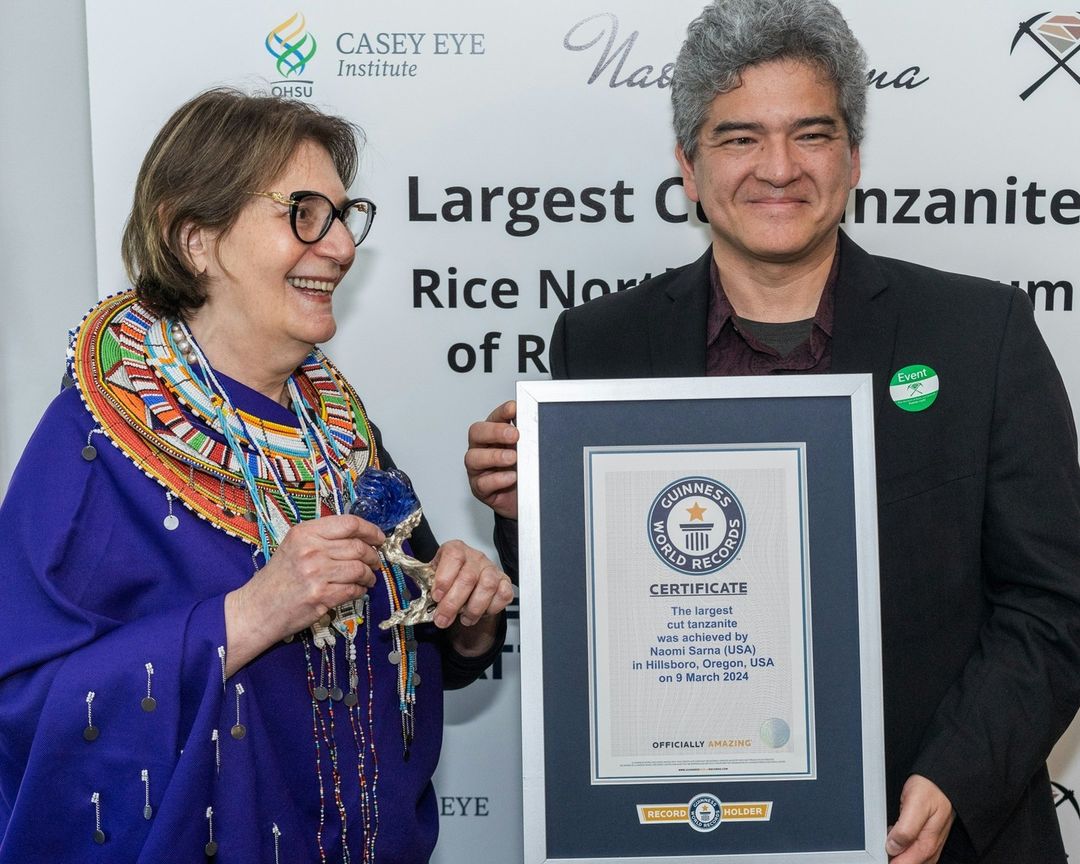 Naomi Sarna, who hand-carved the L’Heure Bleu, receives her Guinness World Record plaque in Oregon