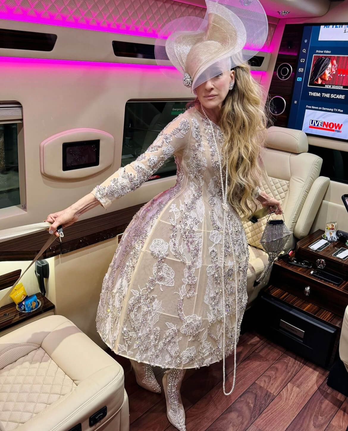 For the 2024 Met Gala, Sarah Jessica Parker arrived in a custom couture gown and headpiece by British designer Richard Quinn, as reported by Harper’s Bazaar.