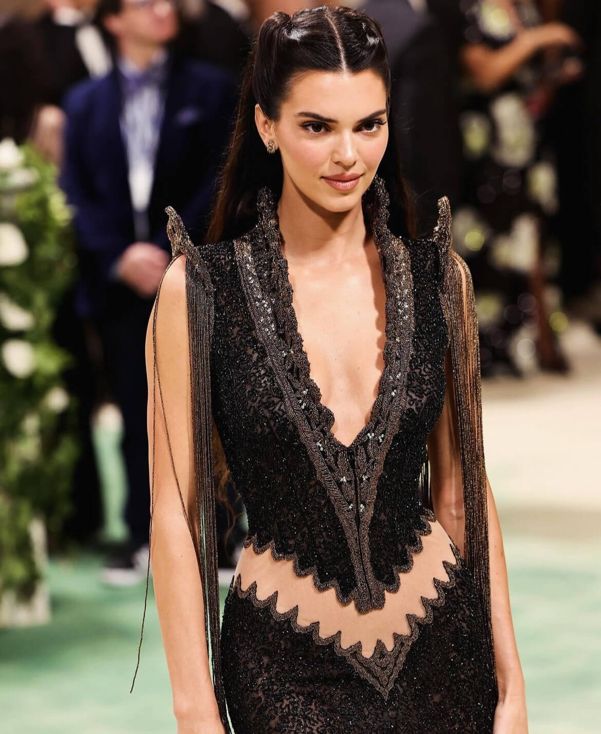 Jenner expressed her excitement about wearing McQueen's creation, telling Vogue about its unique features, including a scalloped butt cutout, a high-neckline, and intricate beaded details.