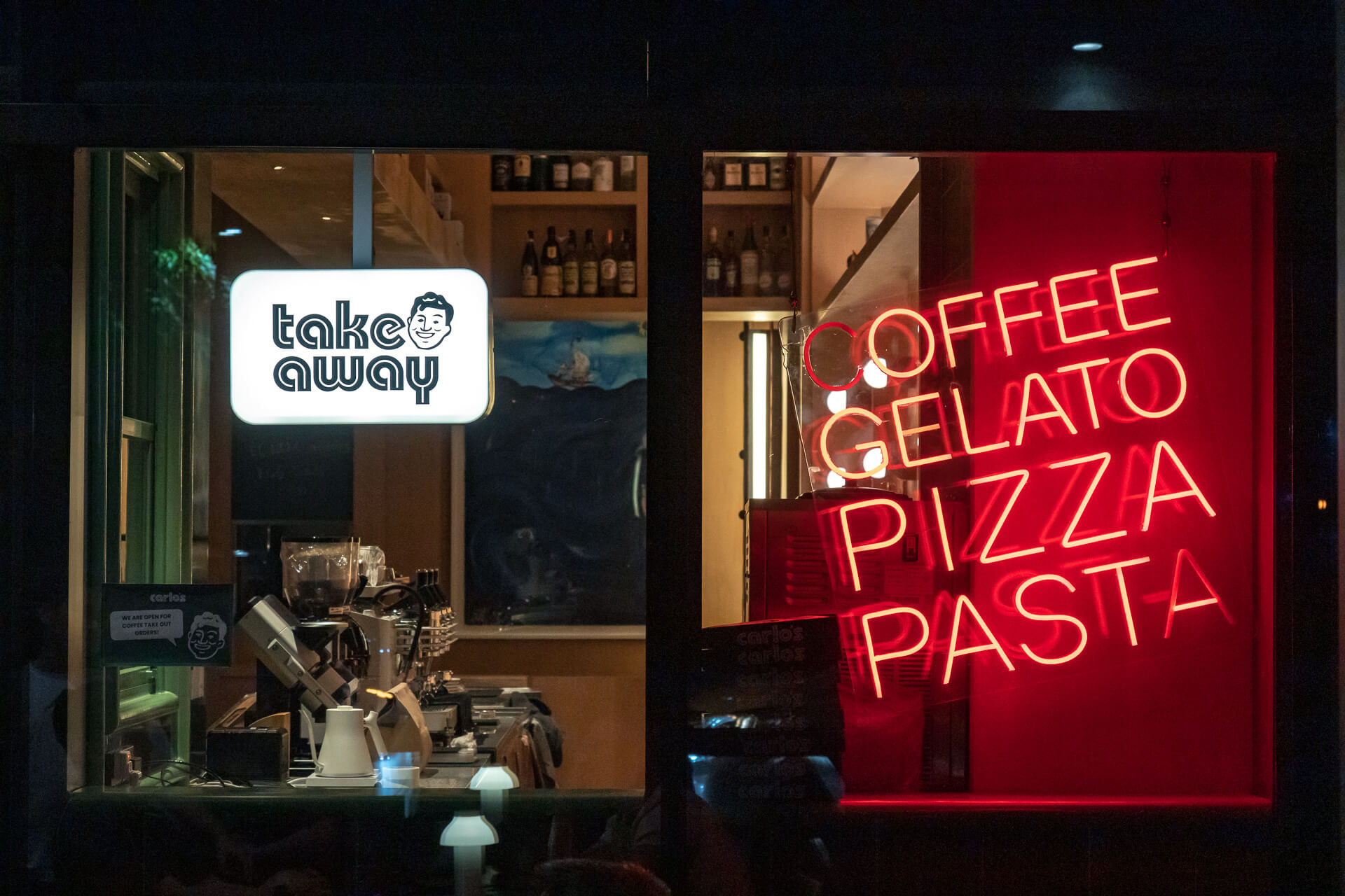 The facade of Carlos at night, and its delightful takeaway corner