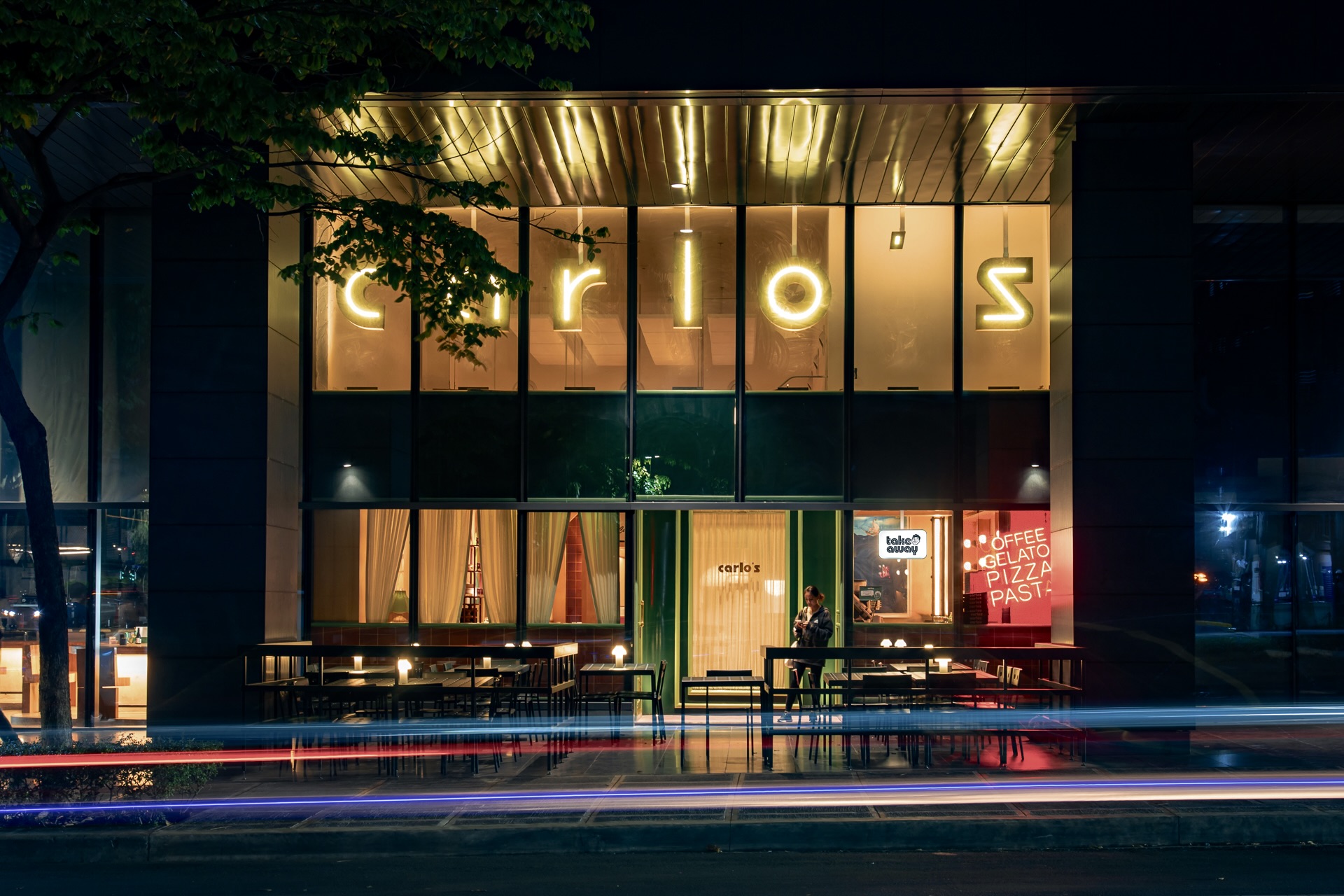 The facade of Carlos at night, and its delightful takeaway corner