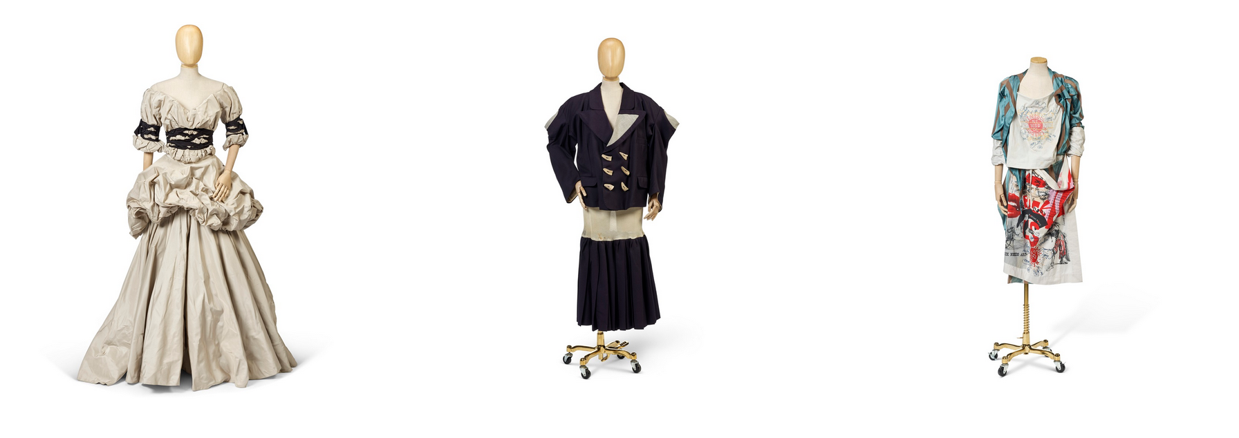 L-R: A dress from "Dressed to Scale" (Autumn/Winter 1998/99); a two-piece ensemble from the ‘Witches’ Collection (Autumn/Winter 1983); a dress and apron set from the ‘Propaganda’ Collection (Autumn/Winter 2005/06)