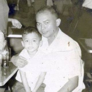 A young Joel Nuñez and his father