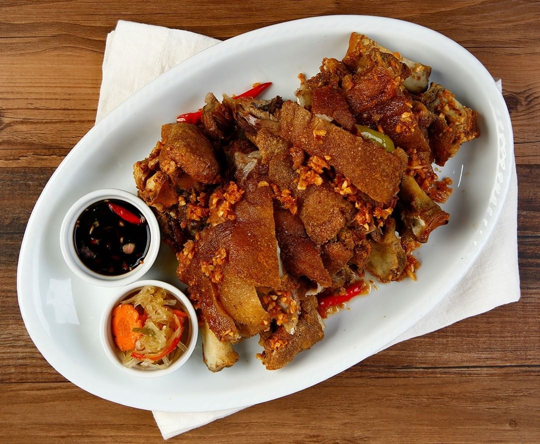 TOP LEFT: Bistek Tagalog ng Kano. TOP RIGHT: Crispy Patang Bawang. BOTTOM LEFT: Tilapia with Sweet Plum Sauce. BOTTOM RIGHT: Sisig Fried Rice.