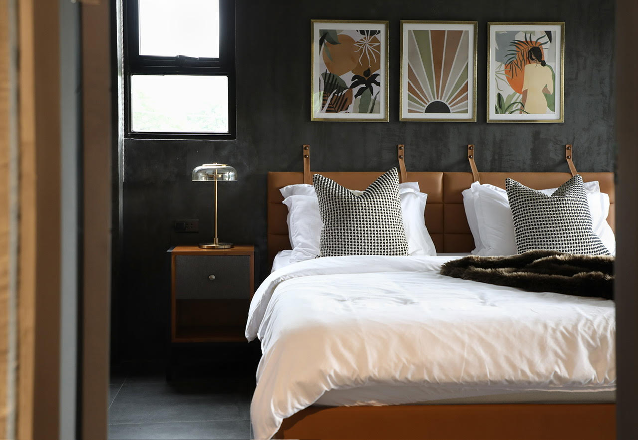 LEFT: From concept to design implementation, applying a masterful mix of materials is key to create an ambiance that evokes a comfortable and moody environment/Photo by Arthur Tselishchev. RIGHT: A textured wall complements the modular cabinetry in this contemporary style kitchen/Photo by Jar Concengco.