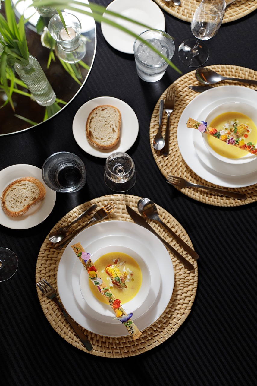 TOP LEFT: USDA Beef Wellington and Lobster Tail. TOP RIGHT: Mango Panna Cotta. BOTTOM LEFT: Poached Salmon with Potato Puree and Asparagus. BOTTOM RIGHT: Corn Chowder with Lavash.