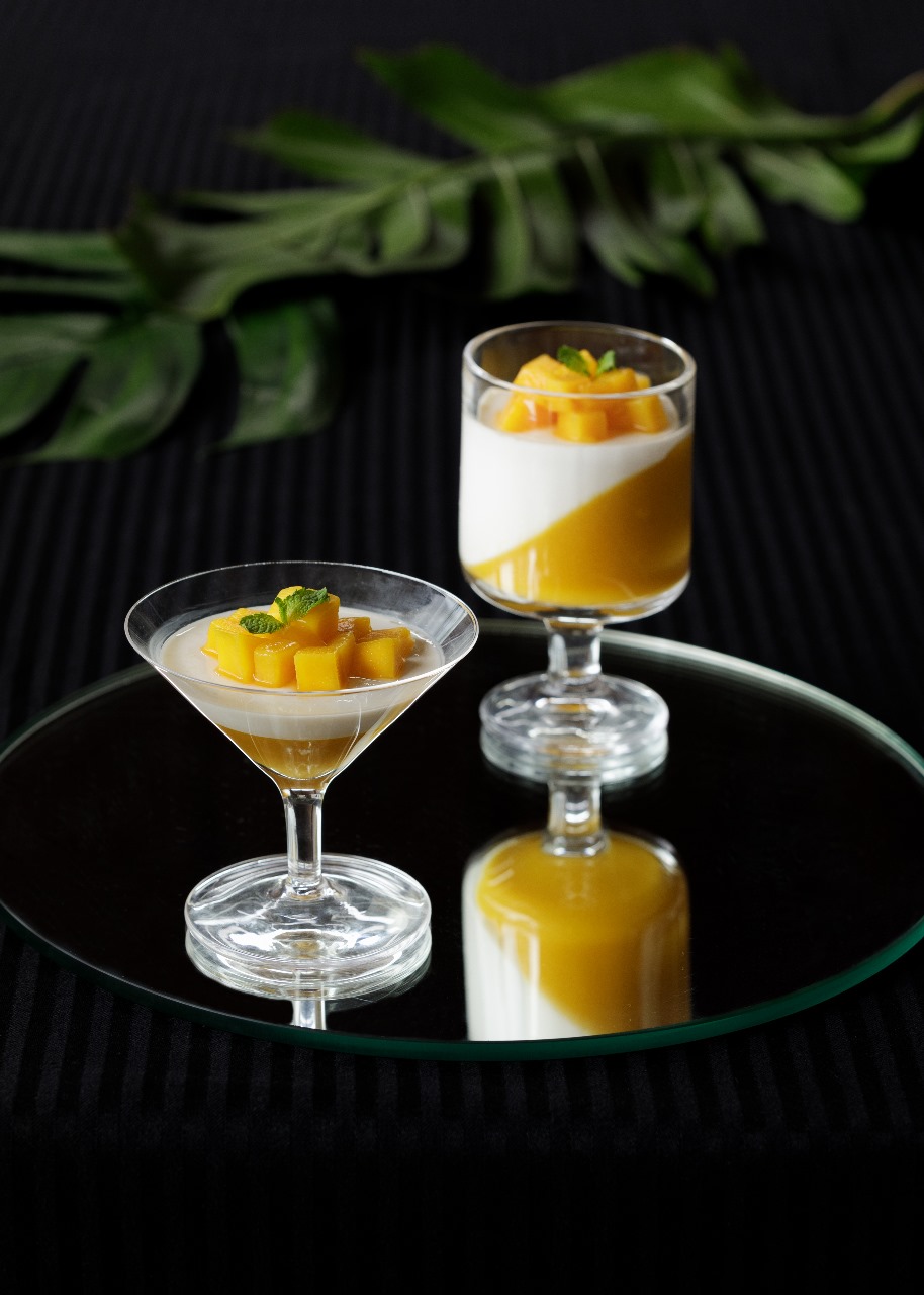 TOP LEFT: USDA Beef Wellington and Lobster Tail. TOP RIGHT: Mango Panna Cotta. BOTTOM LEFT: Poached Salmon with Potato Puree and Asparagus. BOTTOM RIGHT: Corn Chowder with Lavash.