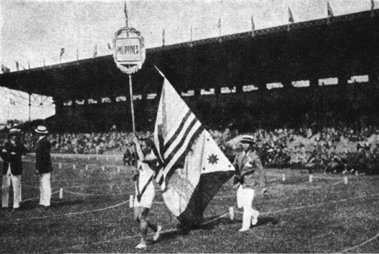 David Nepomuceno holding the Philippine and United States Flag at the opening ceremony of the 1924 Summer Olympics