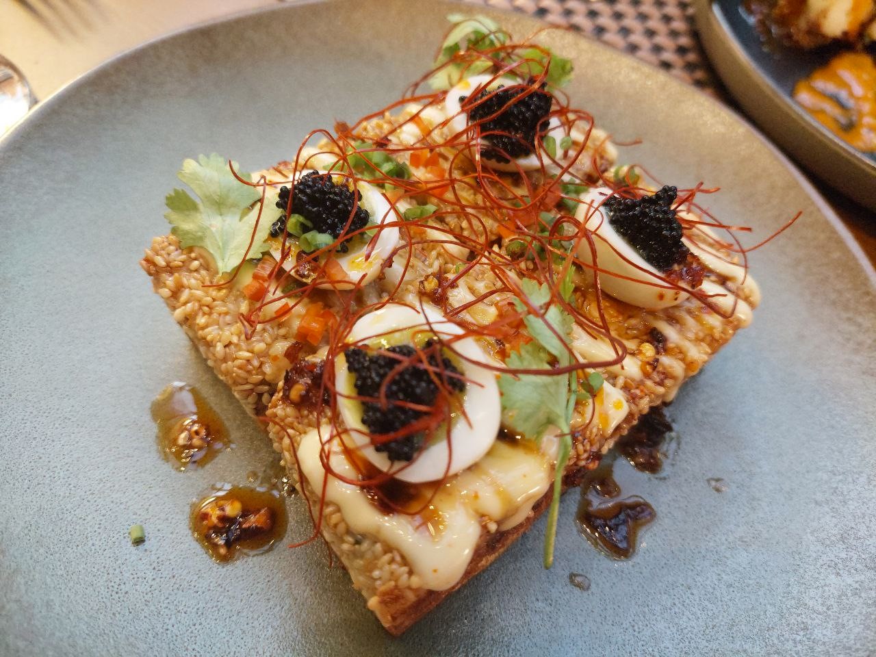 TOP LEFT: Prawn Toast. TOP RIGHT: Charred Cauliflower. BOTTOM LEFT: Grilled Eggplant & Whipped Feta-Tofu. BOTTOM RIGHT: Smoked Salmon Nori Chip.
