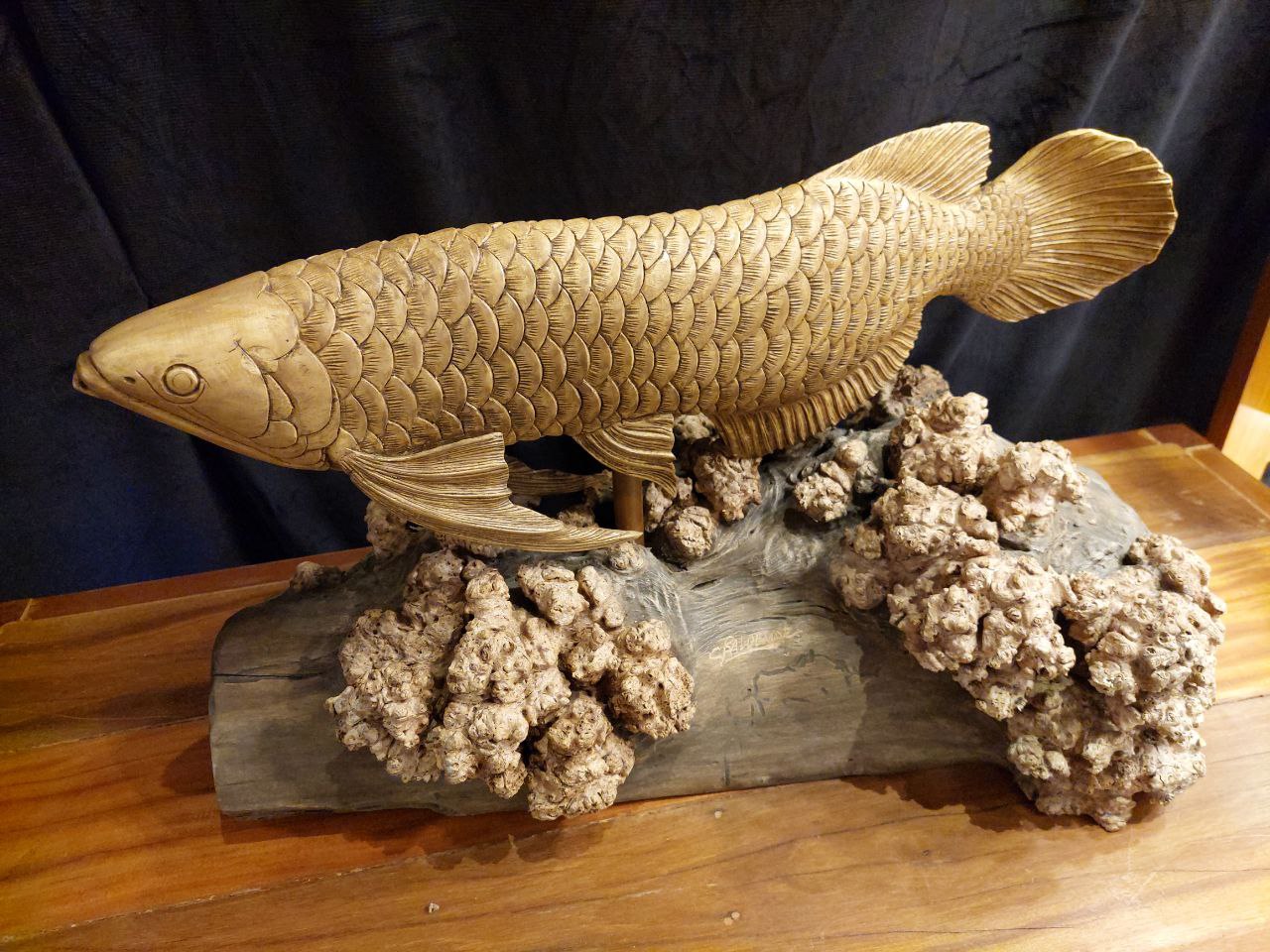 Intricate wooden sculptures by Charming Baldemor (top left and right), along with a Filipino nativity scene from the local artisans she works with