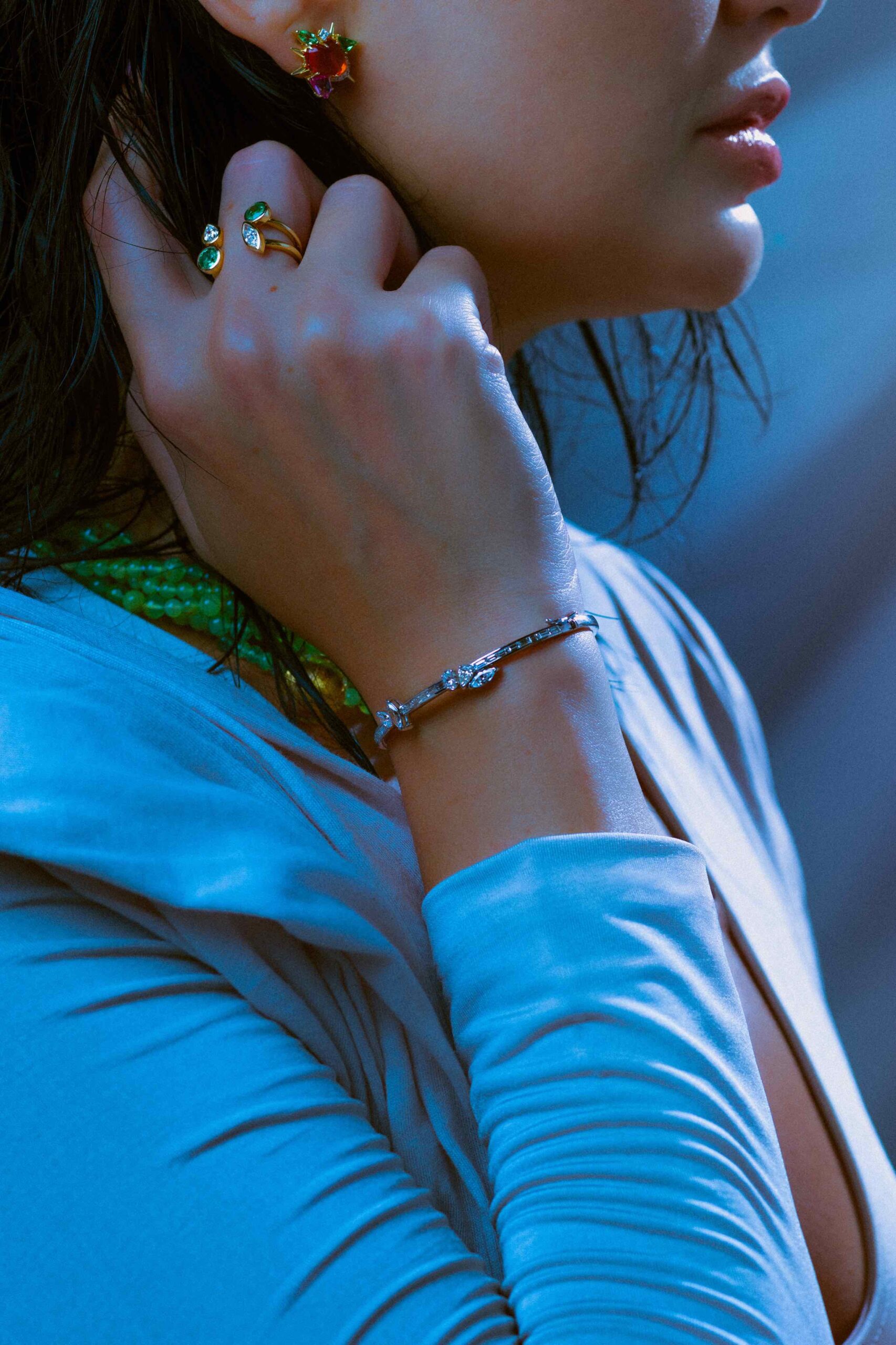 Diamond bangles, emerald open rings, and fire opal and tsavorite earrings by Paul Syjuco