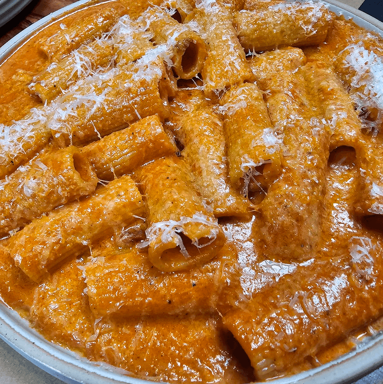 LEFT: Rigatoni, 'Nduja, Guanciale. RIGHT: Creme Caramel.