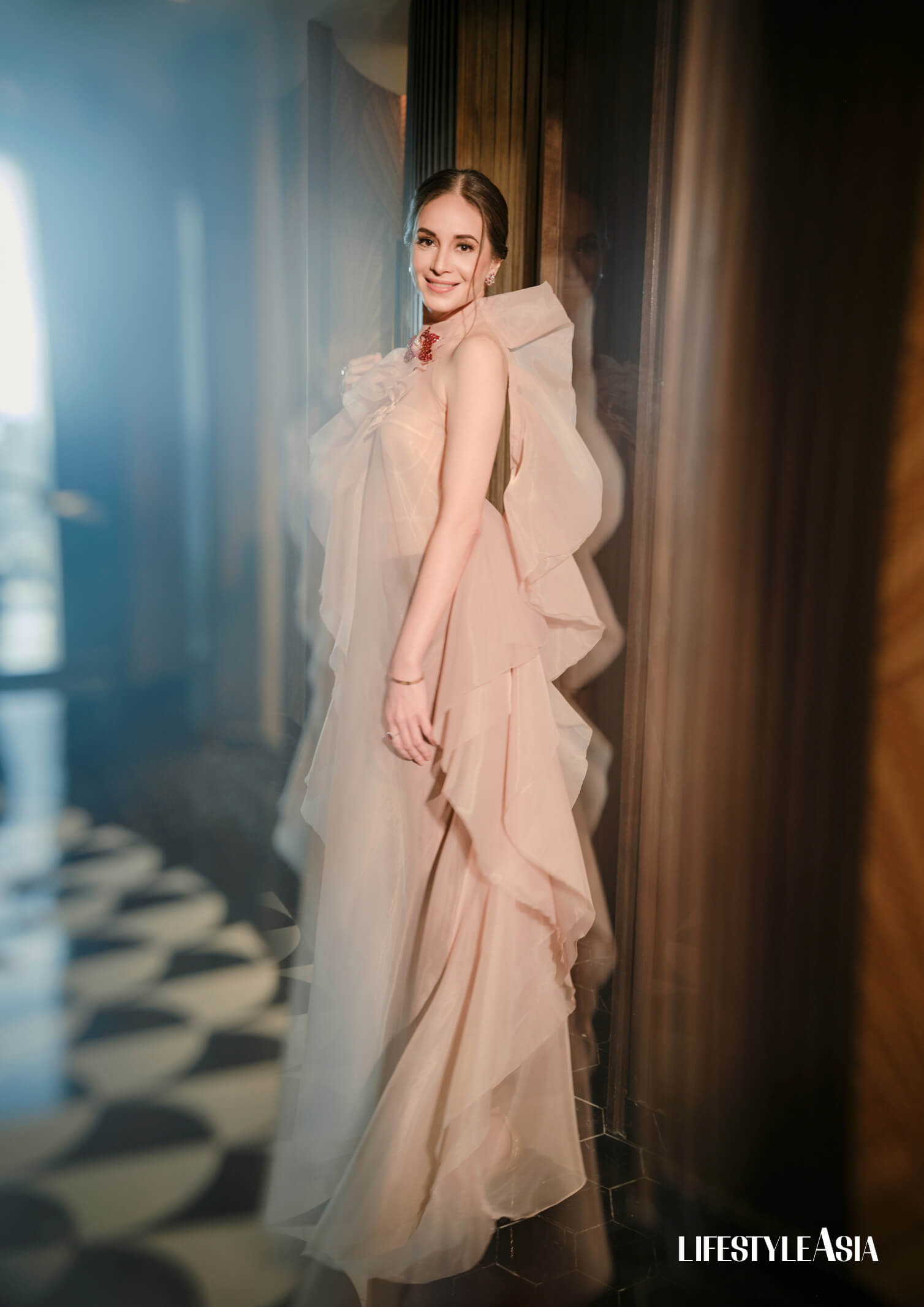 Nude organdy ruffle dress, ANDREA TETANGCO. Jewelry by JUL B. DIZON.