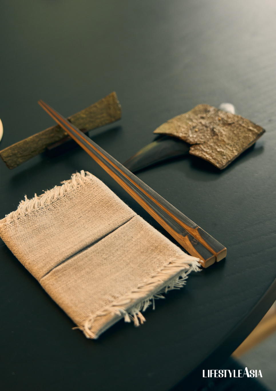 The table set-up, which features napkins made from inabel fabric, and susutake chopsticks from Japan