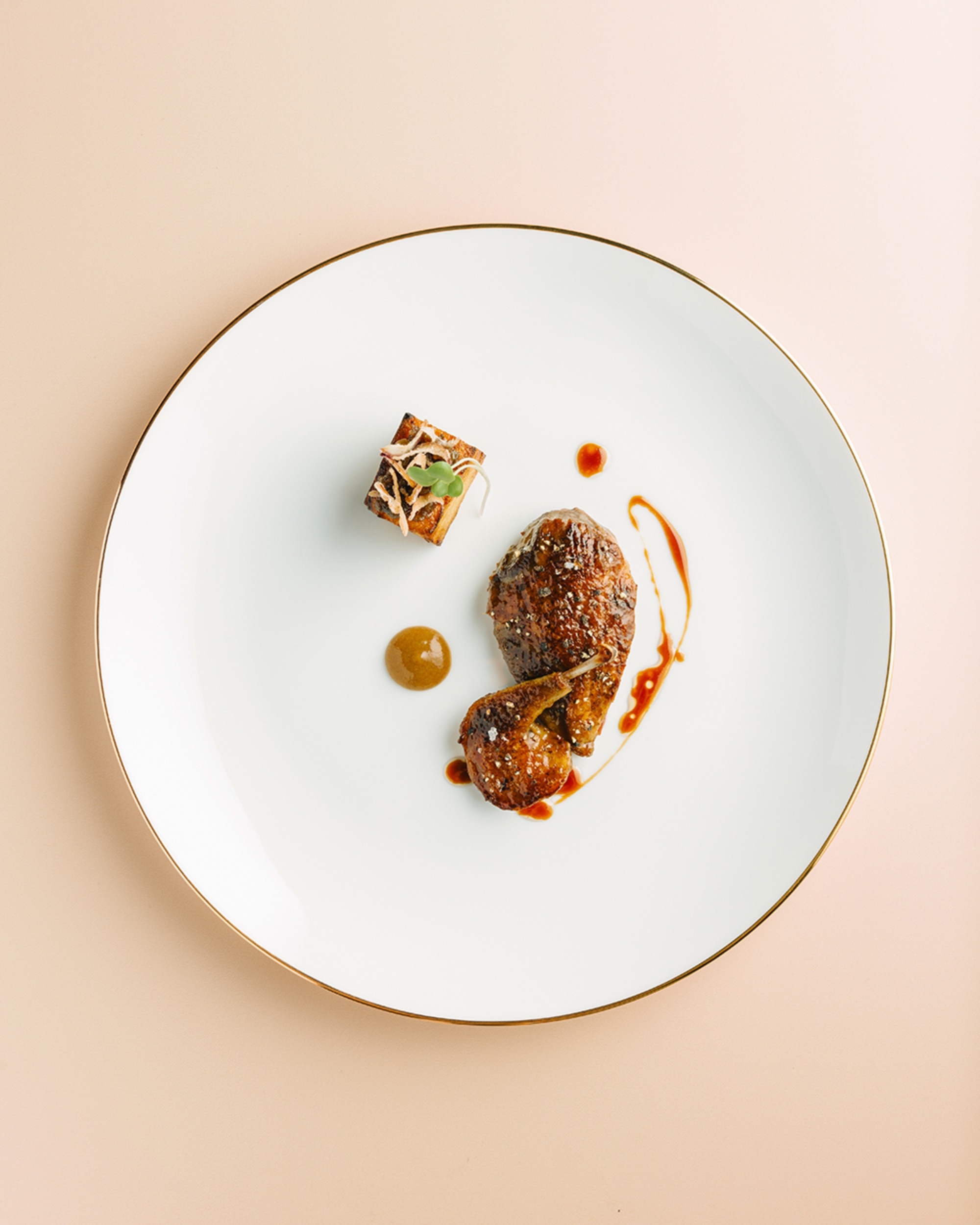 Chef Miko Calo's Pigeon & Kamias whole Brittany Pigeon, kamias glaze, caramelized onions, shallot crisp, potato gratin