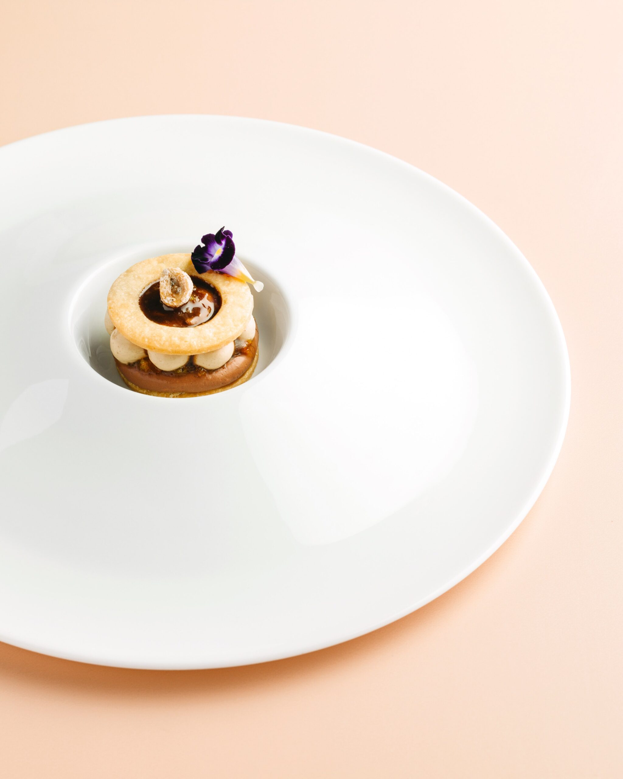 Chef Miko Calo's  Chocolate & Orange (chocolate namelaka, hazelnut praline, hazelnut chantilly, hazelnut crocanti, candied orange peel, paté sablée)