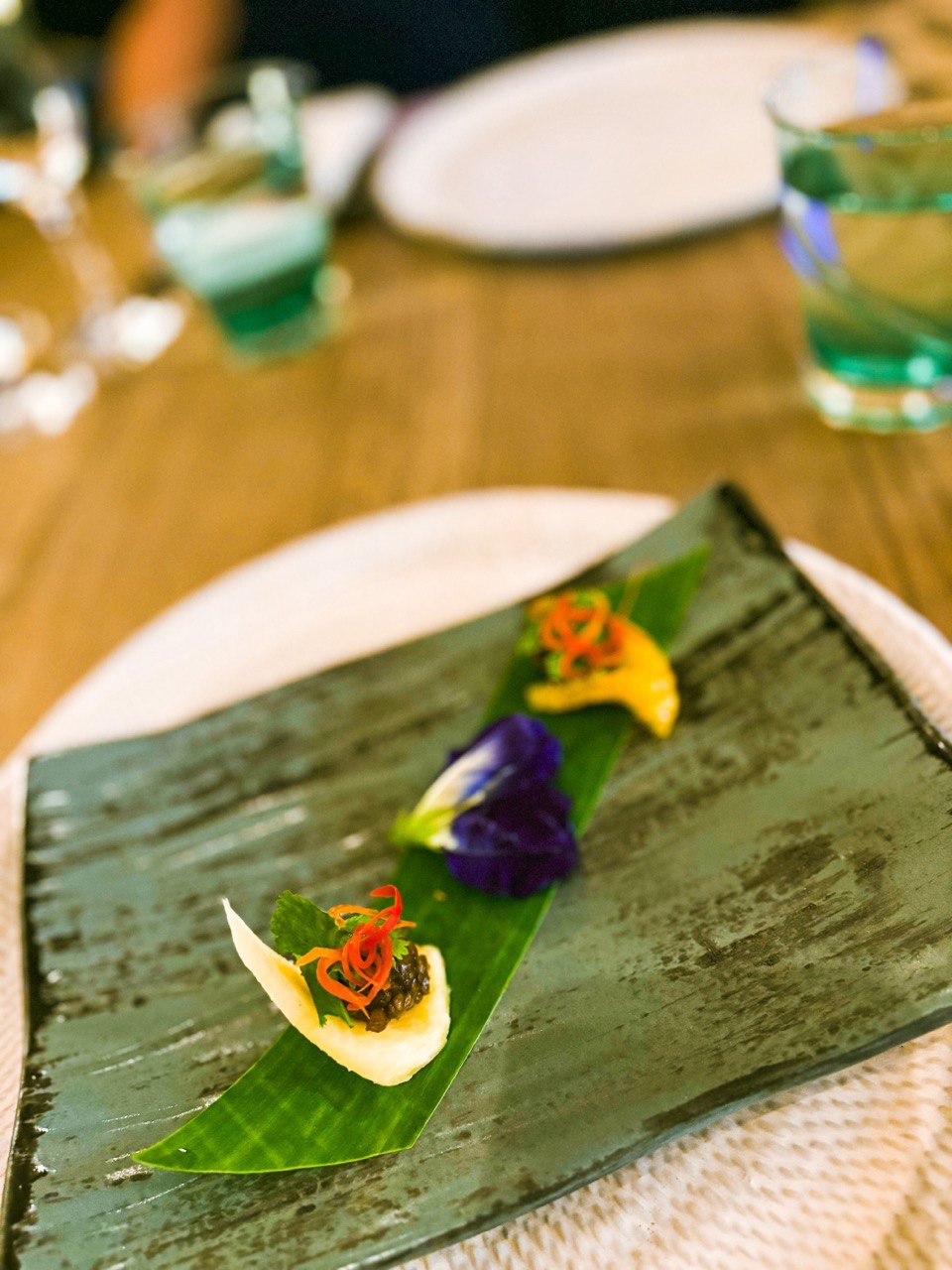 Amuse Bouche: Ma Hor, featuring pineapple, orange, caramelized chicken and peanuts