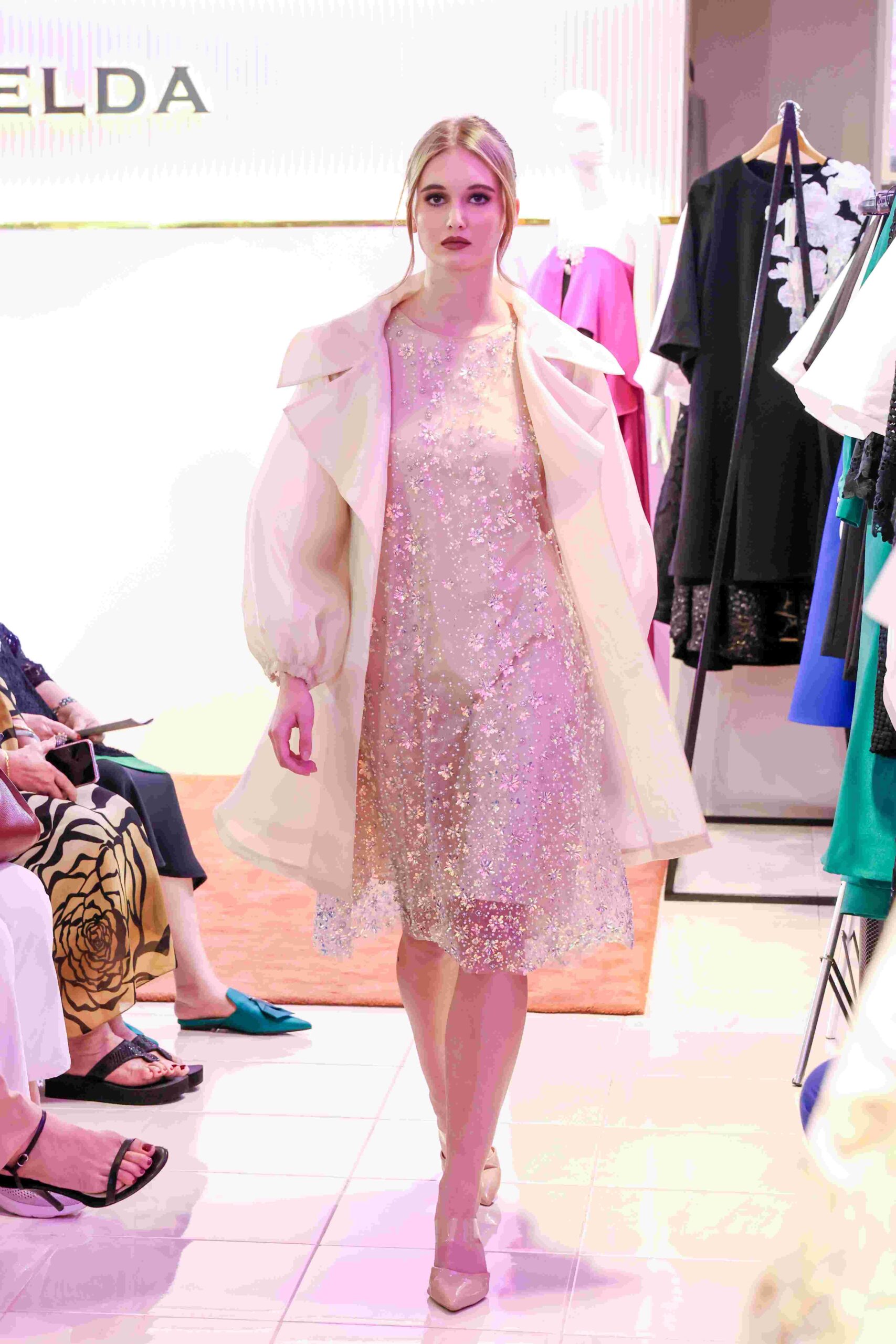 Model wearing cream organza trench coat and glitter dress by Criselda Lontok