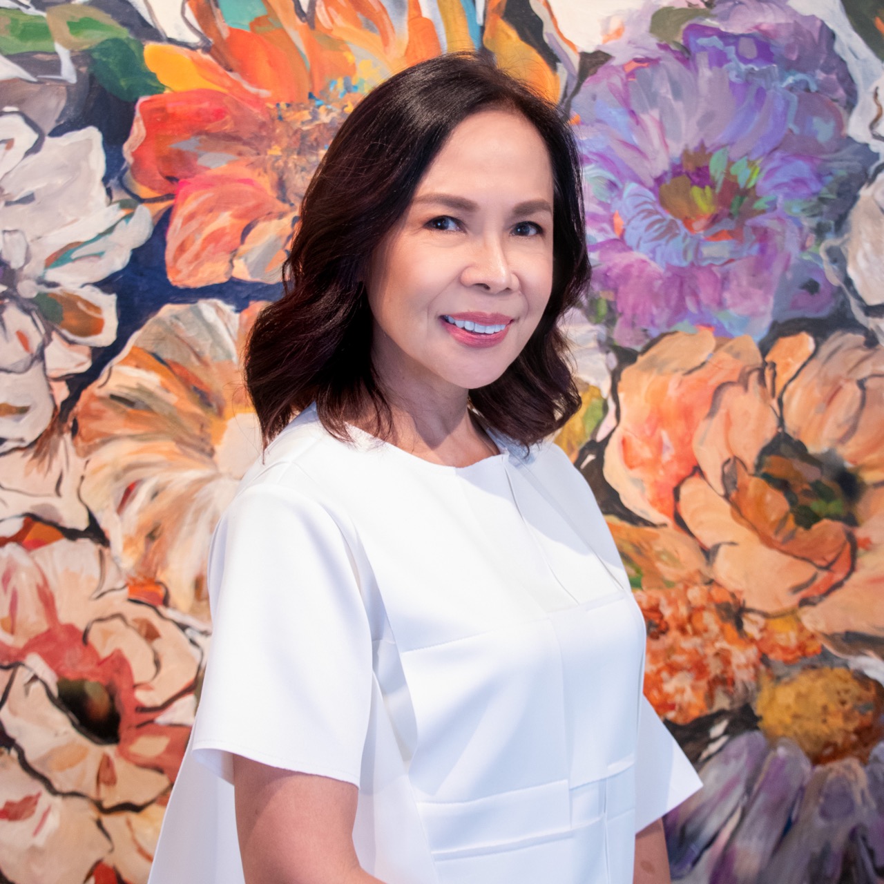 International fashion designer Michael Cinco wearing his coat inspired by artist Gustav Klimt; Caroline “Bing” Taojo in front of her canvas work