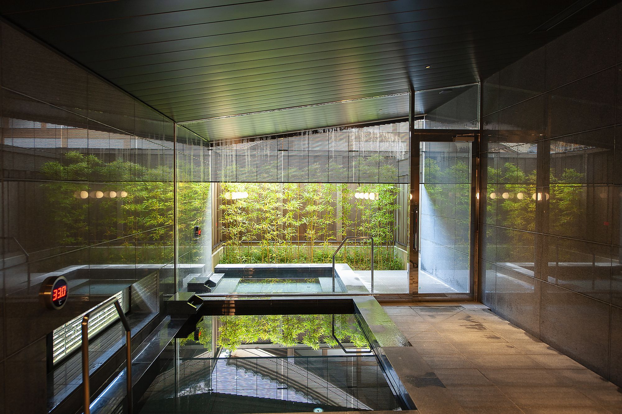 The open-air bath at Hakujukan allows guests to relax in its warm waters in Fukui Japan