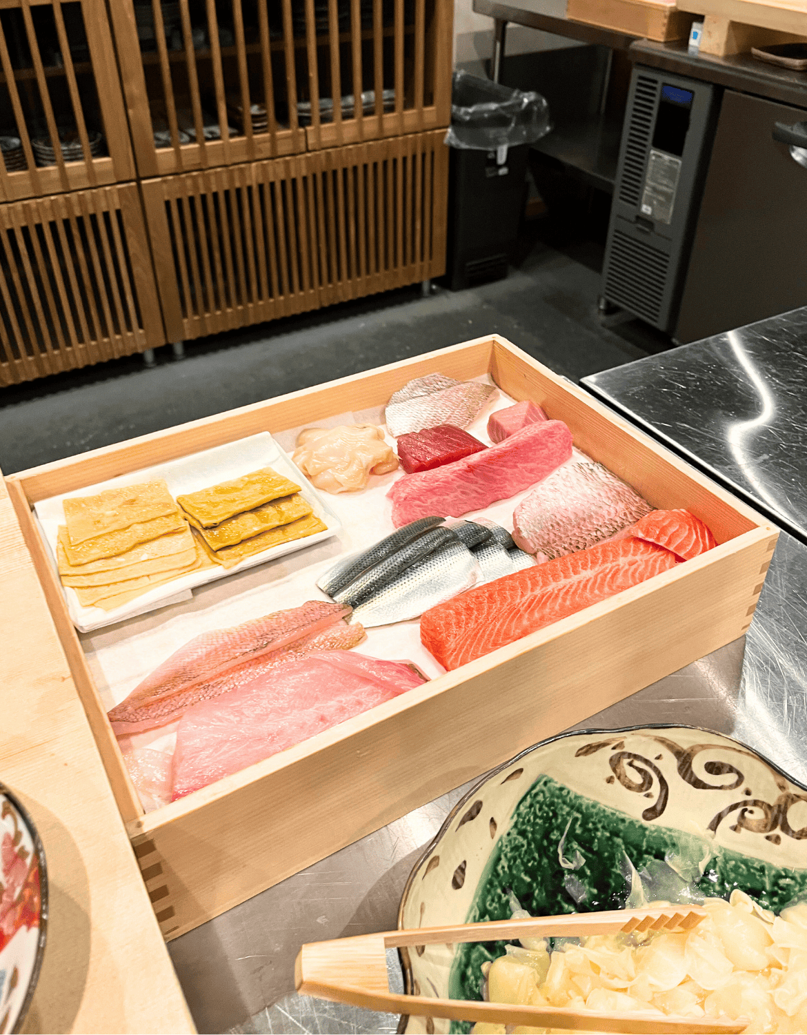 For the omakase, chefs choose the finest fish from a display to craft each nigiri