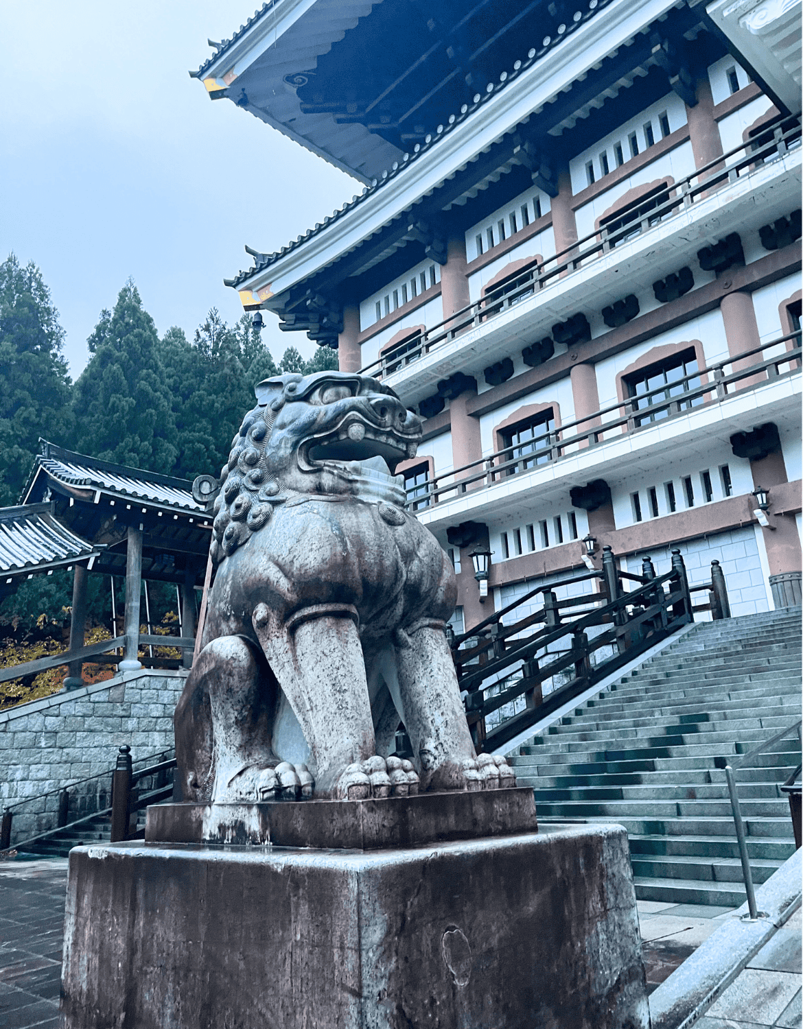 A stone line stands guard at the entrance of the Great Hall of the Echizen Daibutsu in Fukui Japan