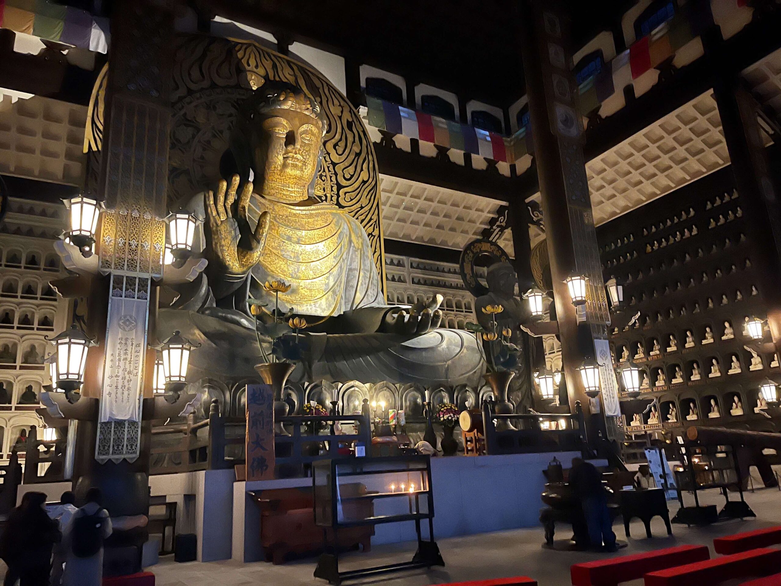 The Great Buddha of Echizen Daibutsu, surrounded by hundreds of smaller statues in Echizen Daibutsu Fukui Japan