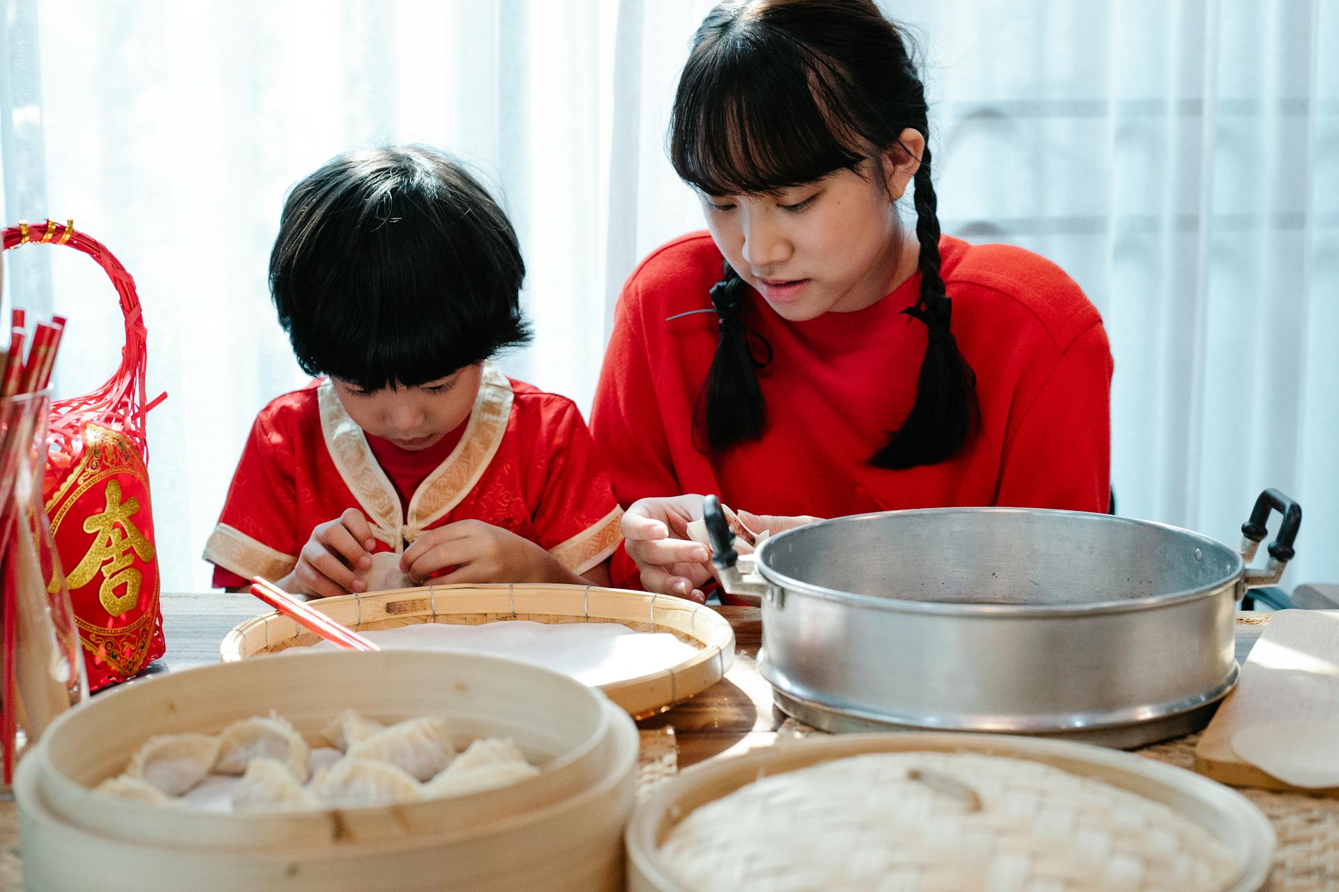 Families prepare food, like dumplings, together from scratch on Lunar New Year