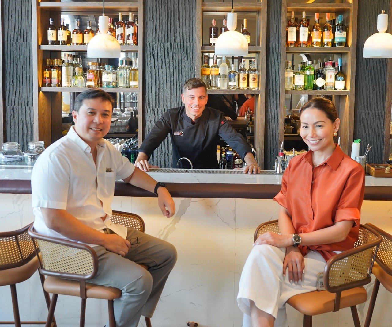 Chef Luis Martinez in between Bistrot Le Coucou owners Carlo and Jackie Lorenzana
