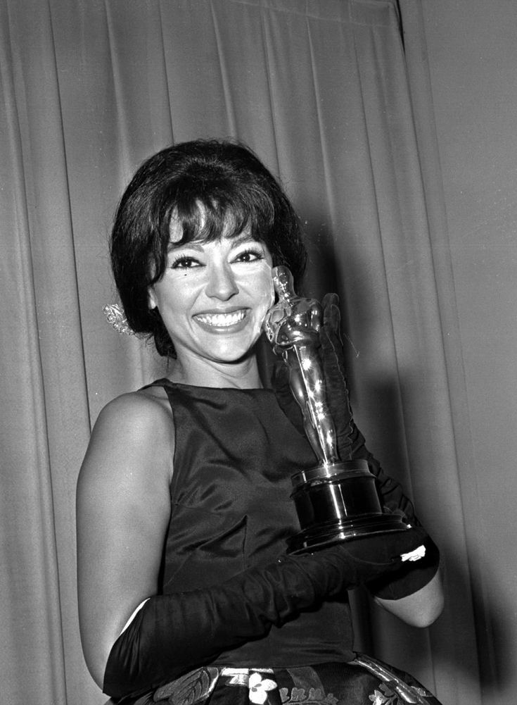 Rita Moreno accepted her Academy Award for Best Supporting Actress in a custom Pitoy Moreno gown