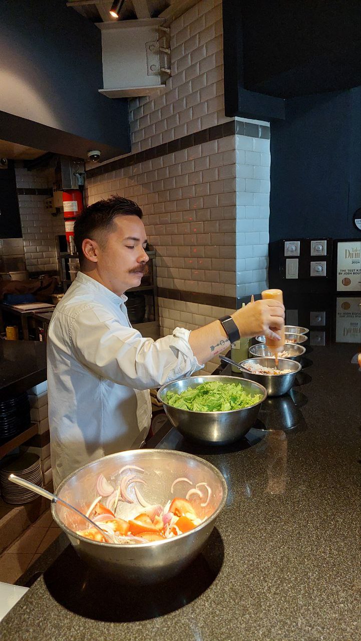 Boutwood mixing gochujang sauce into a grains bowl and making a French vinaigrette  healthy meal prep