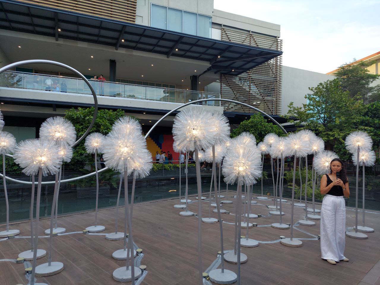 Olivia d'Aboville next to her installation "Wonderland of Lights"