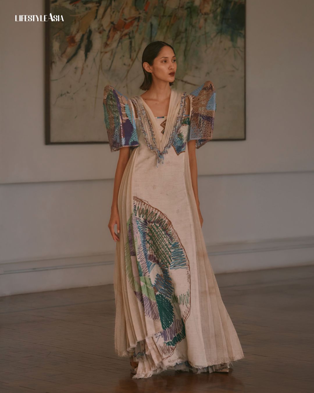 “Hills of Nikko” (1964) by Jose Joya, from the collection of the National Museum of Fine Arts; Terno by Bryan Peralta, Pura Esurdia (Silver) awardee, inspired by the bold and expressive strokes of Joya, incorporating 3D-printed and hand-painted butterfly sleeves